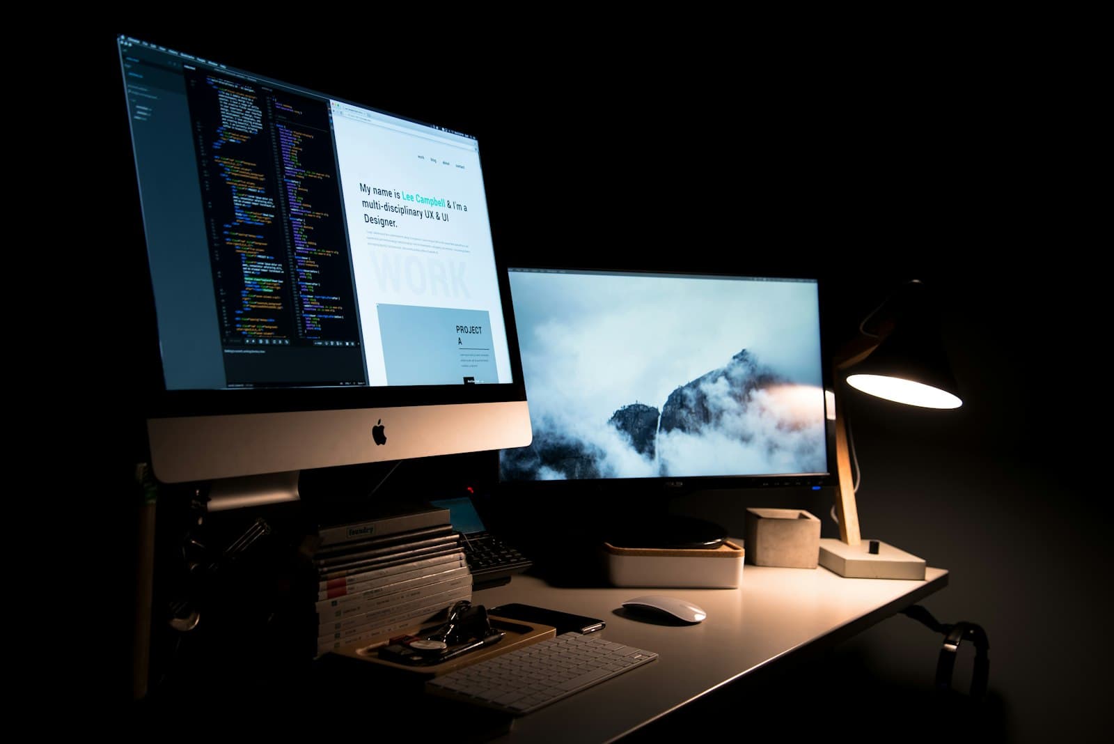 Designer's workspace with a laptop, sketches, and color palette during a custom website project